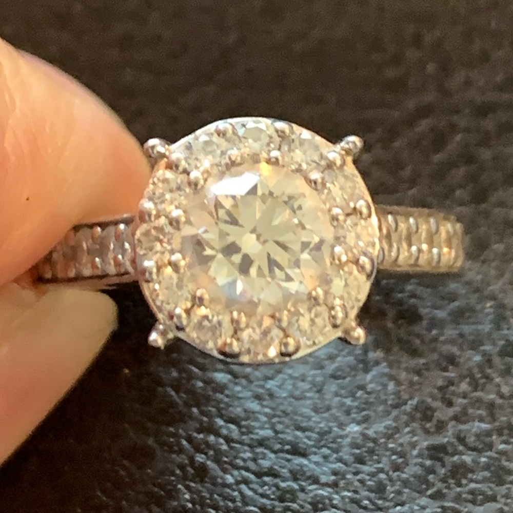 Platinum halo diamond engagement ring.